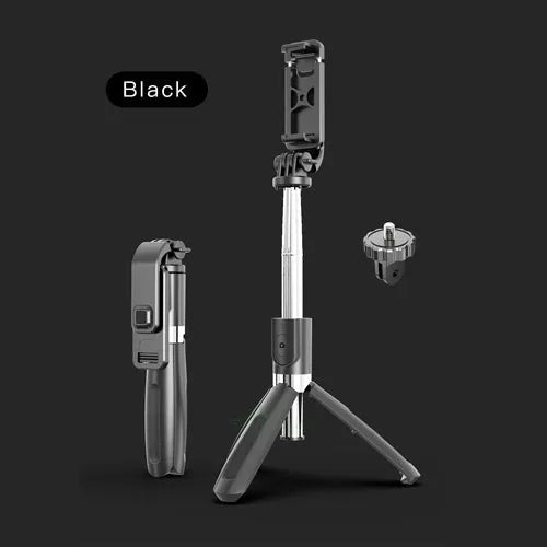 Black Bluetooth selfie stick with wireless remote, extended next to a phone and GoPro camera on its tripod base.