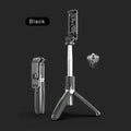 Black Bluetooth selfie stick with wireless remote, extended next to a phone and GoPro camera on its tripod base.