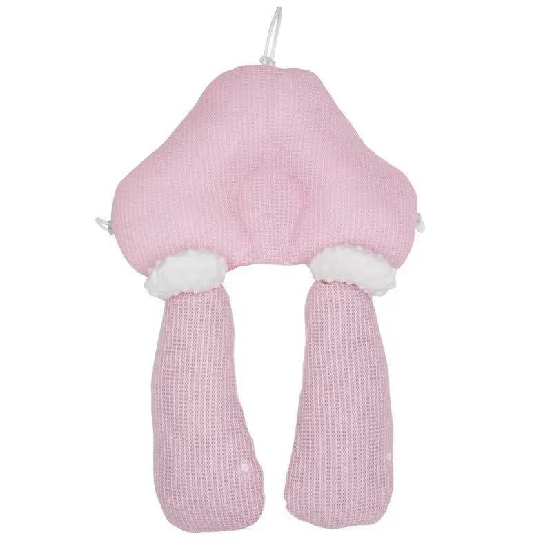 Blue and white U-shaped baby head shaping pillow made of pure cotton on a neutral background.