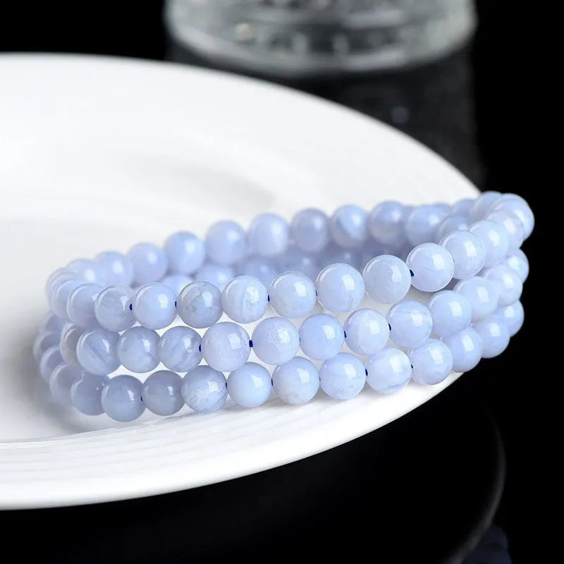 Blue agate bracelet with scattered striped beads and traditional ruyi design elements