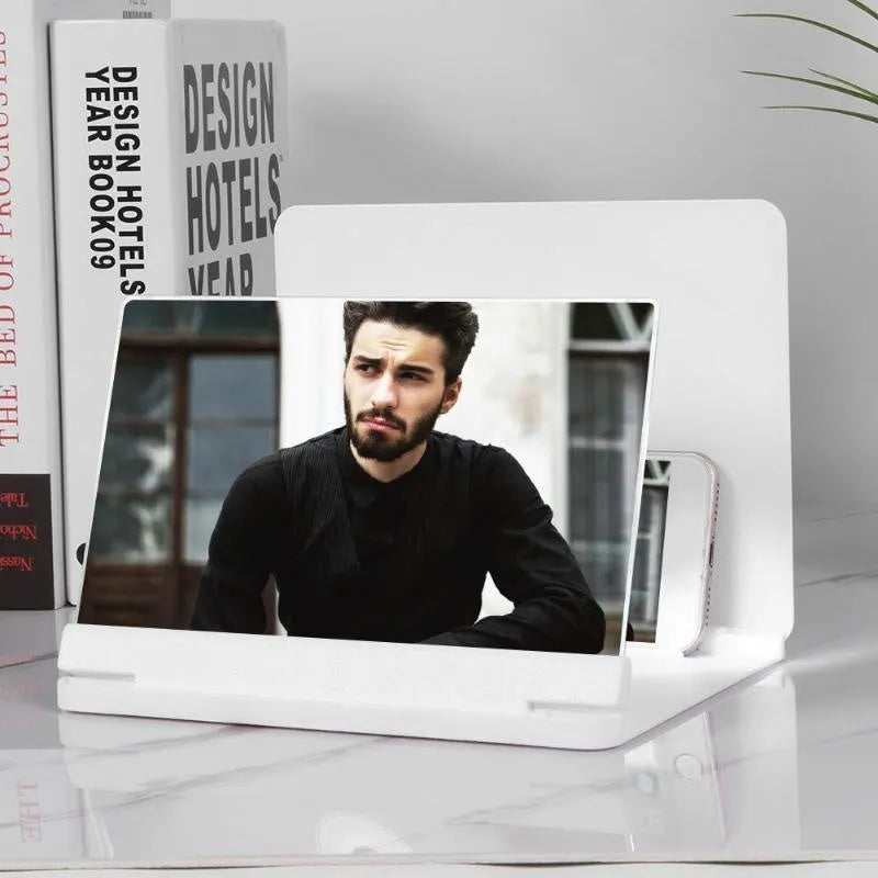White phone screen amplifier showing smartphone magnification with plexiglass lens and fibreboard base
