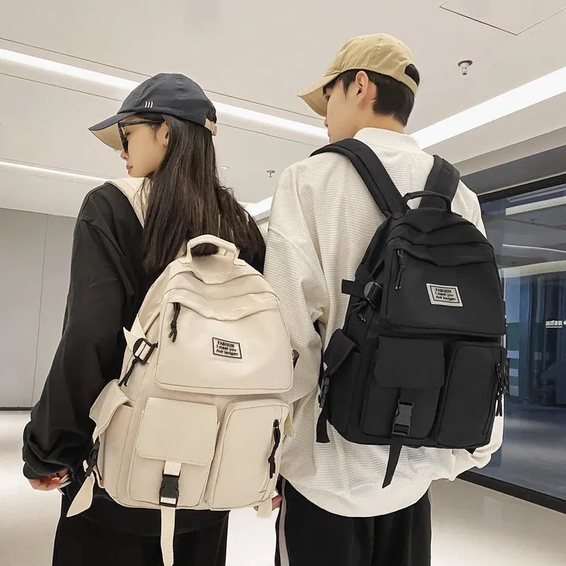 Soft nylon student backpack in black colour with computer compartment and three-dimensional pockets