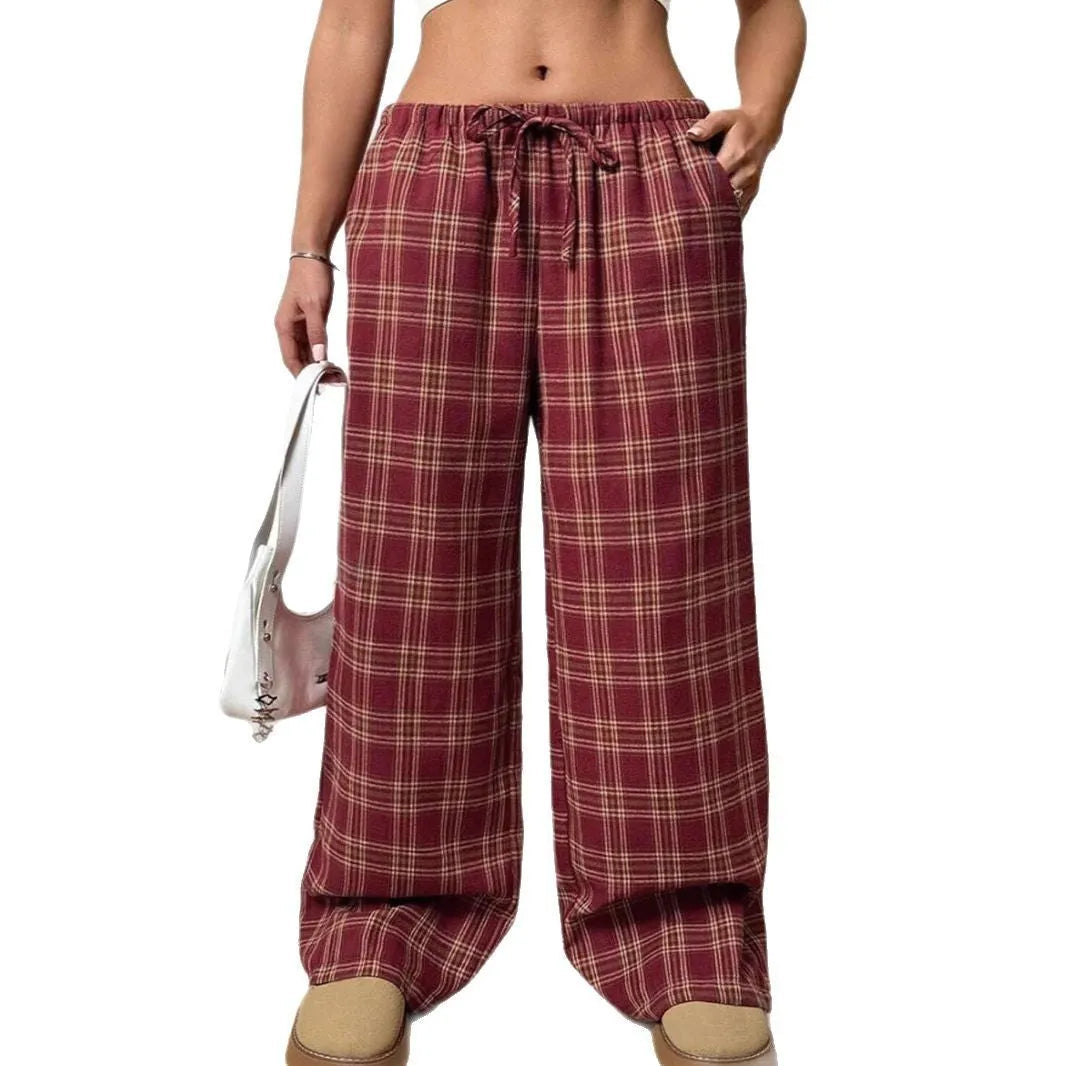 Women's loose plaid trousers with drawstring waist and front pockets in red or blue colours