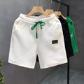 Casual solid-colour polyester sports shorts with micro elasticity on a mannequin.