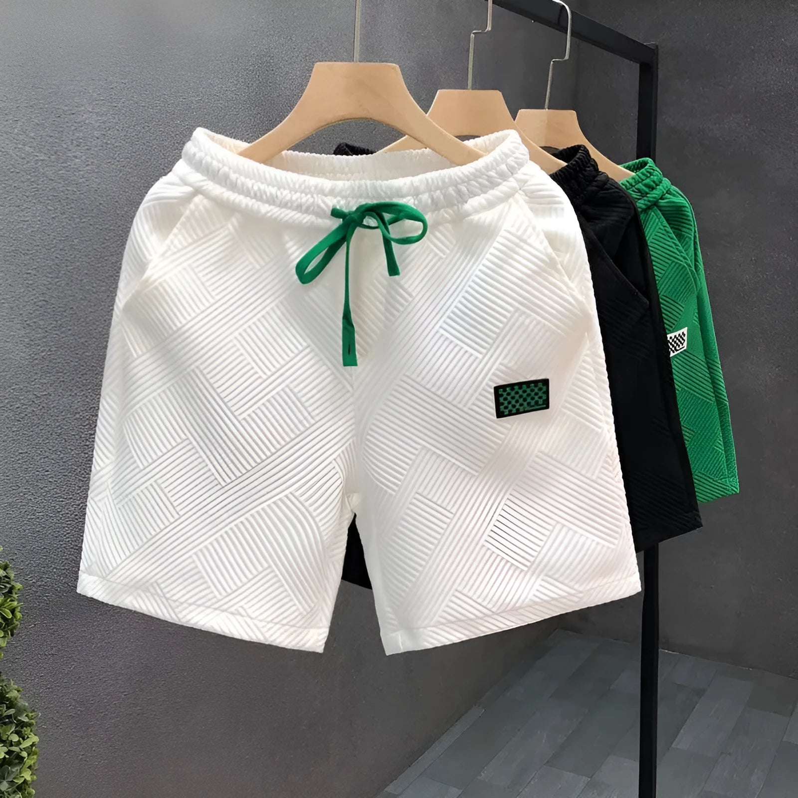 Casual solid-colour polyester sports shorts with micro elasticity on a mannequin.