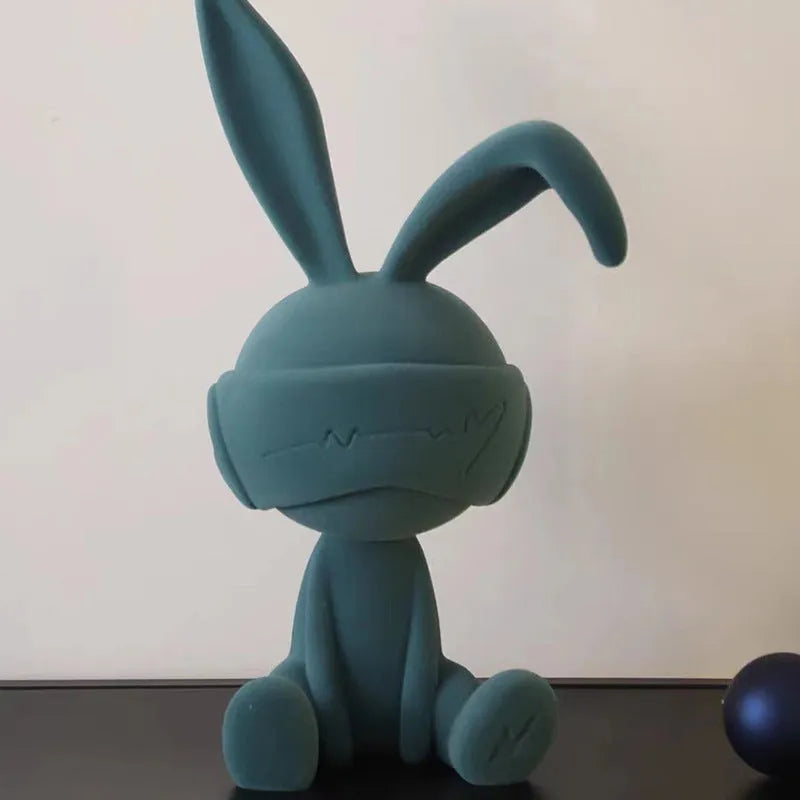 Suede blindfold rabbit resin table ornament in green, blue, or red colour options.