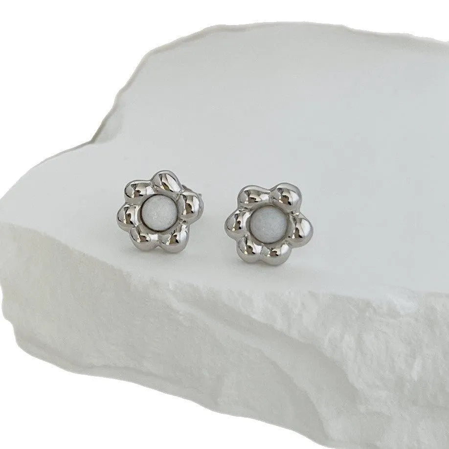 Pair of S925 sterling silver ear studs with black agate flower centre, gold colour, simple geometric shape