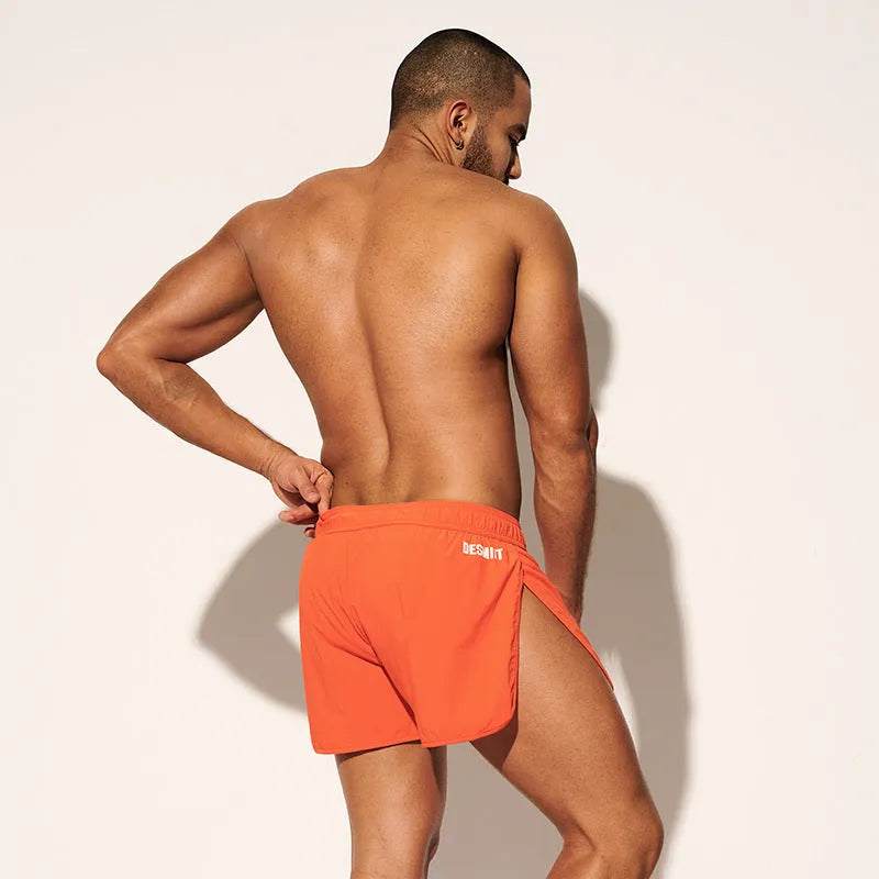 Men's loose fit beach shorts in polyester with elastic waistband for surfing and swimming