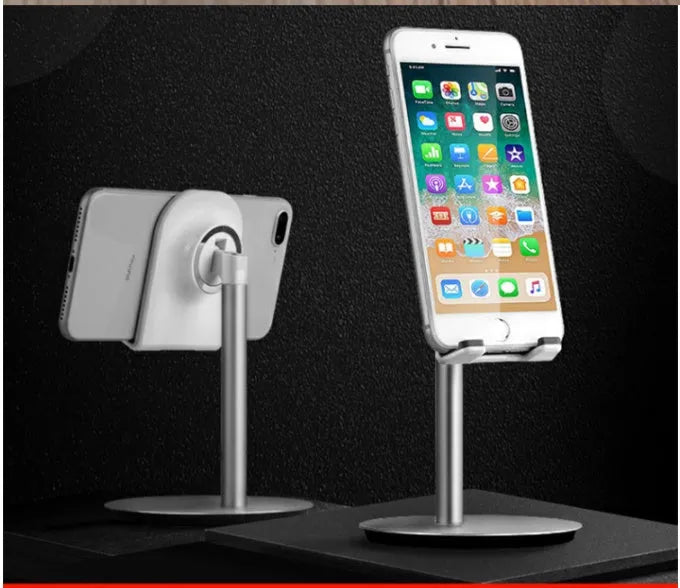 Silver metal S1 universal desktop stand holding a tablet and a mobile phone.