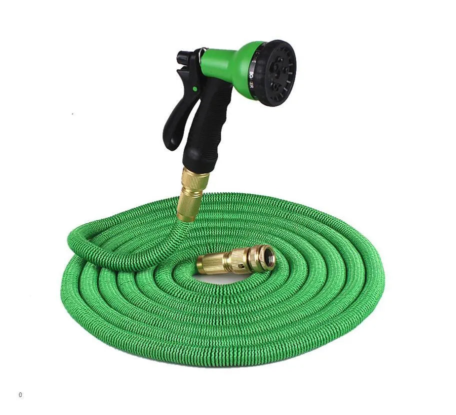 Expandable magic flexible water hose in black laid on grass showing compact initial length and stretched working length
