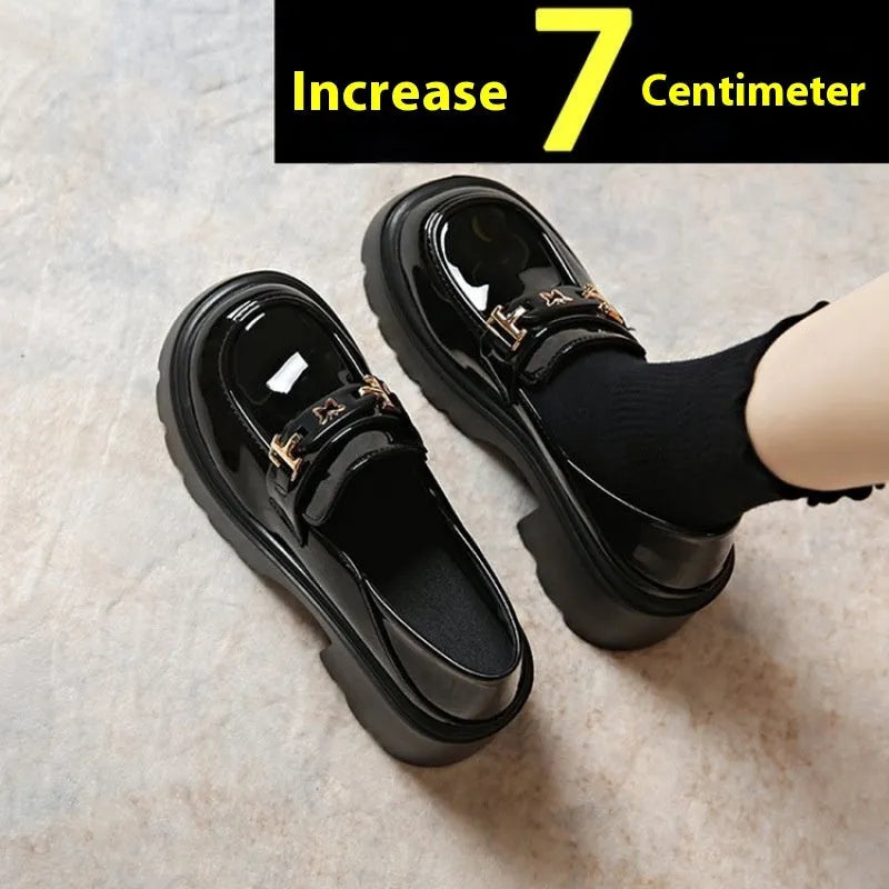 Slip-on chunky heel black leather shoes with skull pattern and square heel on a white background