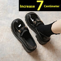 Slip-on chunky heel black leather shoes with skull pattern and square heel on a white background