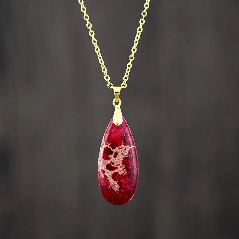 Jade water drop pendant on an 18K gold plated chain, showing hongjin colour finish.