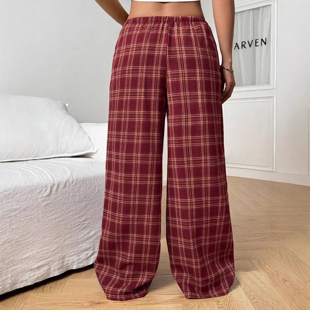 Women's loose plaid trousers with drawstring waist and front pockets in red or blue colours