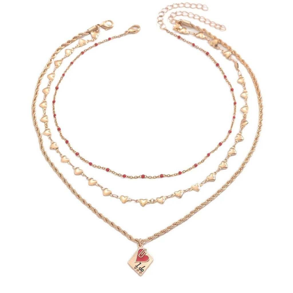 Gold tone three-layer love necklace with geometric pendant on a model.
