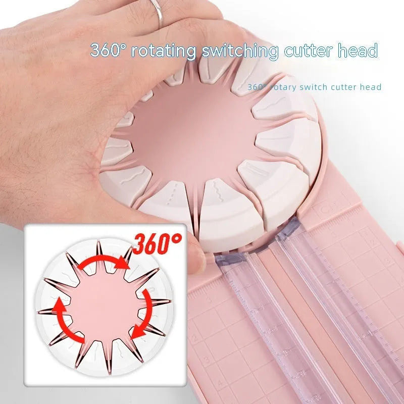 Pink and black 12-in-1 manual plastic paper cutting machine on a white background.