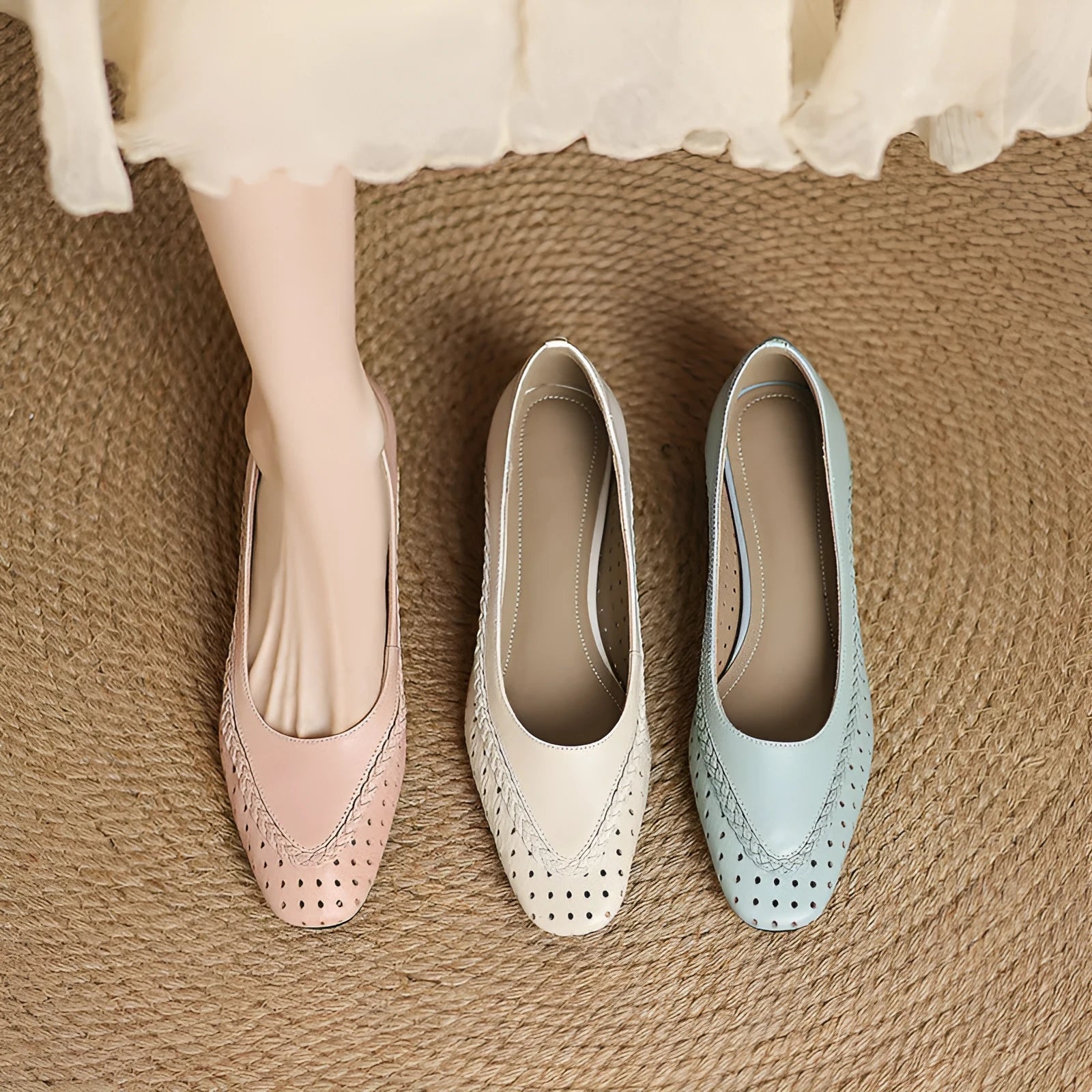Women's beige sheepskin sandals with hollow-out design, round toe, and mid heel.