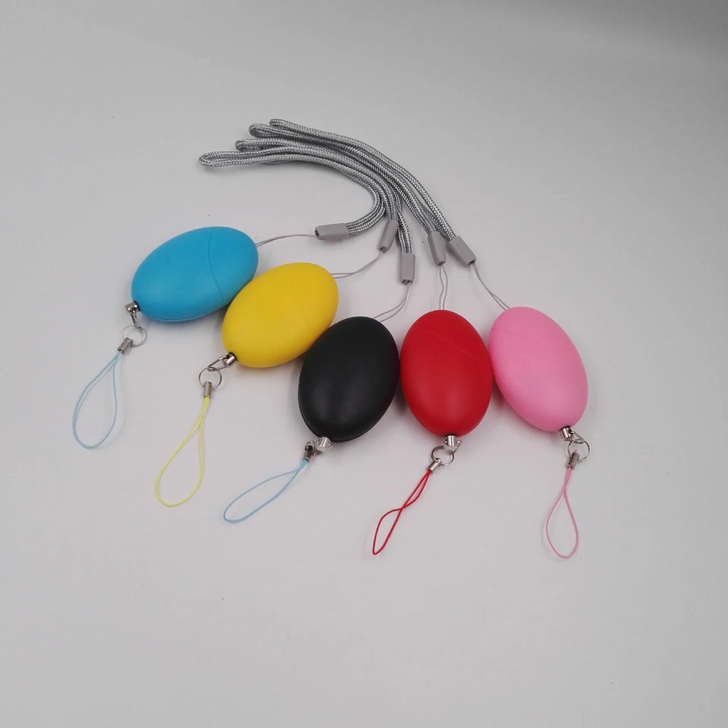 Oval personal alarm in black, blue, pink, red, or yellow with 120dB siren for women, elderly and children
