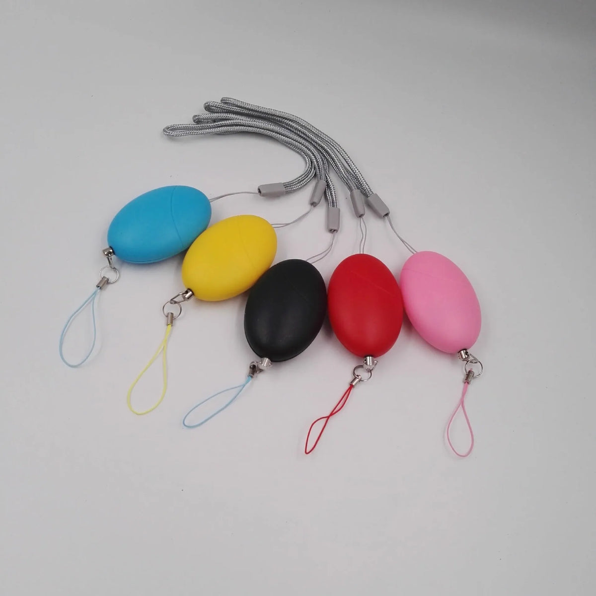 Oval personal alarm in black, blue, pink, red, or yellow with 120dB siren for women, elderly and children