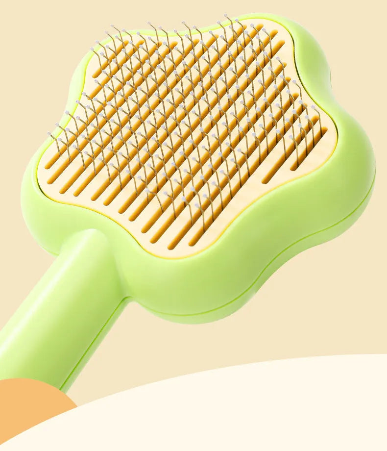 Magic wand cat comb with stainless steel needle teeth and self-cleaning mechanism in green colour