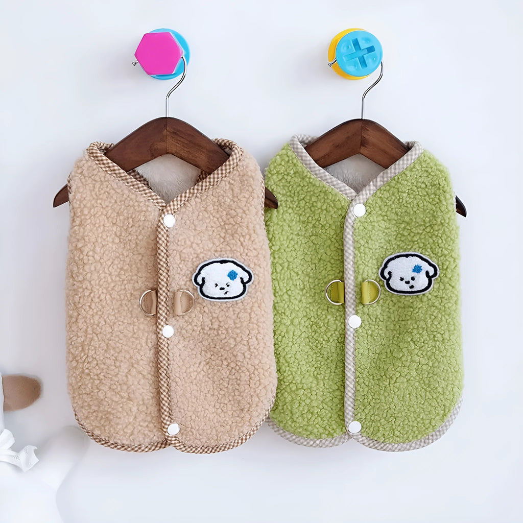 Green coral fleece dog vest with leash ring on a small dog, showing winter outfit.