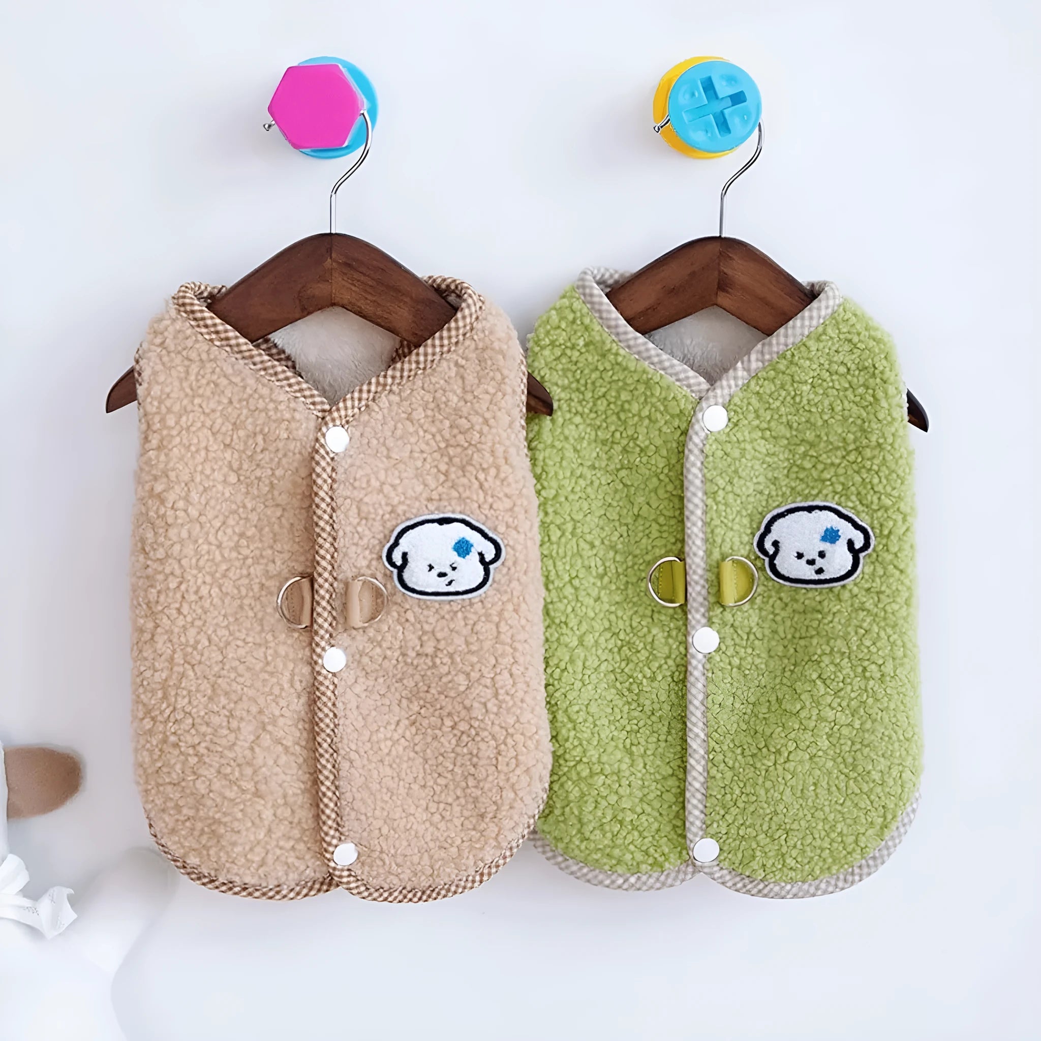 Green coral fleece dog vest with leash ring on a small dog, showing winter outfit.
