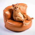 Small lazy cat figurine on a sofa, a 7.5cm high resin car dashboard ornament.