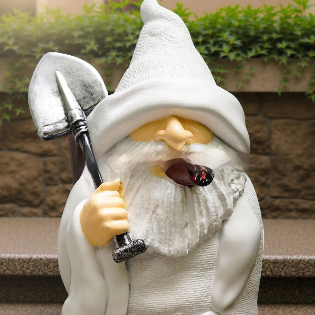 A small resin and plastic Smoking Shovel Dwarf ornament for Christmas garden decoration.