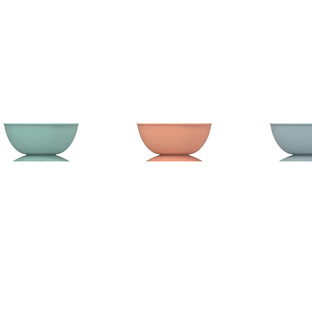 Blue silicone pet slow feeder bowl with textured lick mat surface and suction cup base