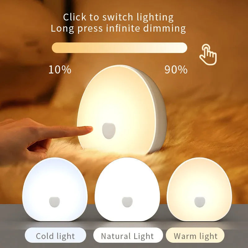 White rechargeable baby night feeding comforter with music function on a neutral background