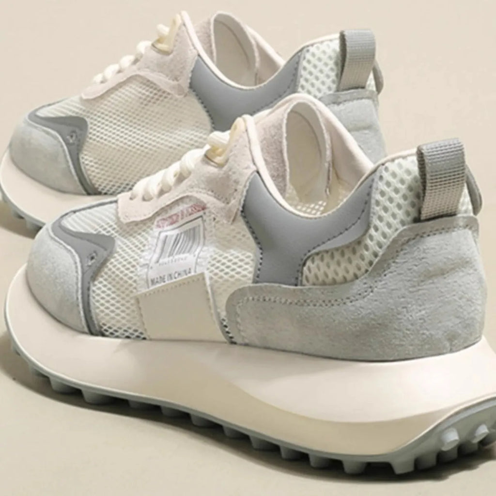 Women's grey and pink low-top retro sneaker with round toe and flat rubber sole