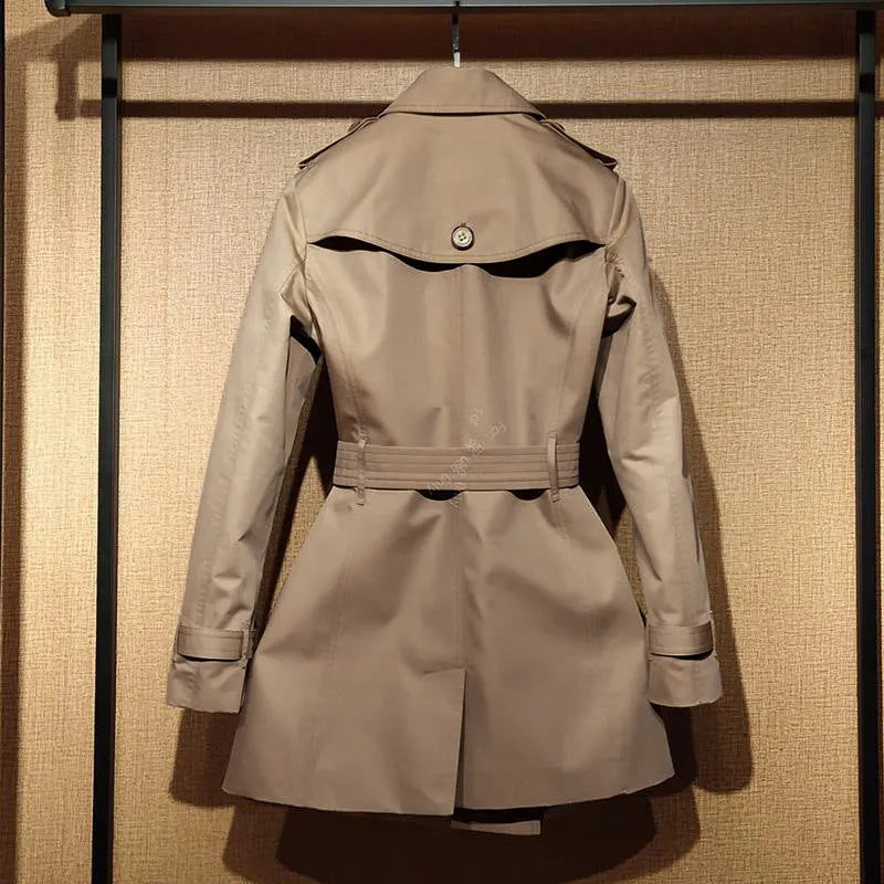 Khaki double-breasted polyester trench coat for women with flight sleeves on a hanger.