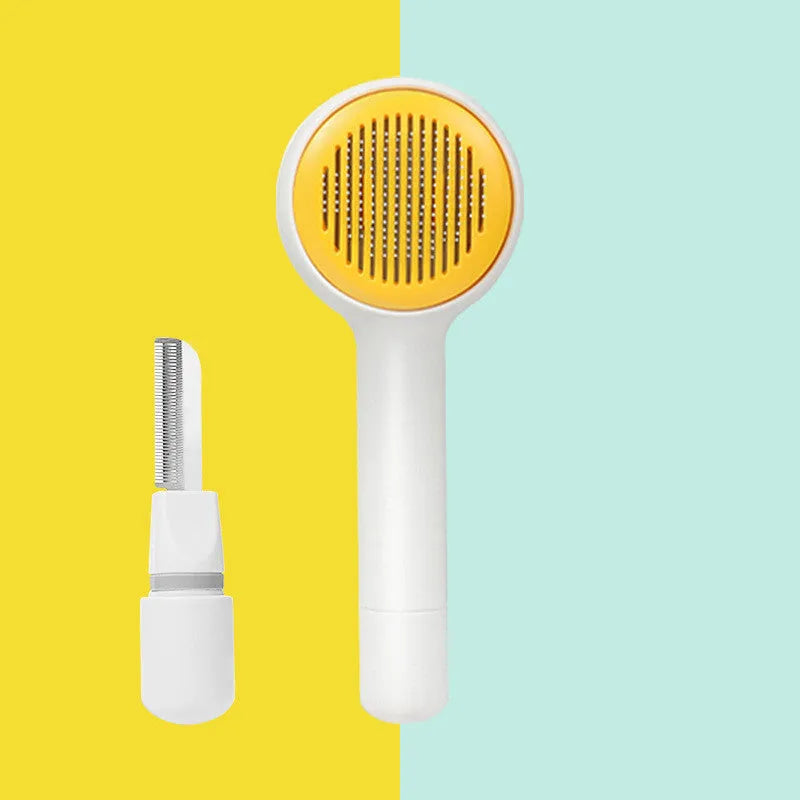 Pink cat combing brush floating needle comb for cats and dogs on white background