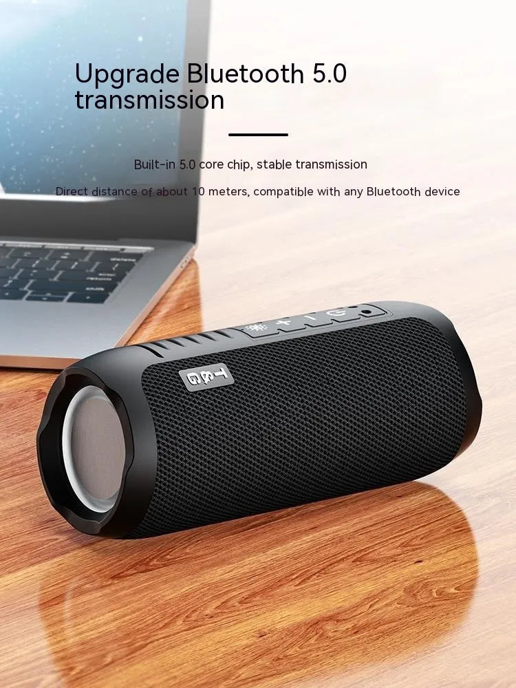 Black Bluetooth stereo mini desktop speaker with four speaker units and mesh grille
