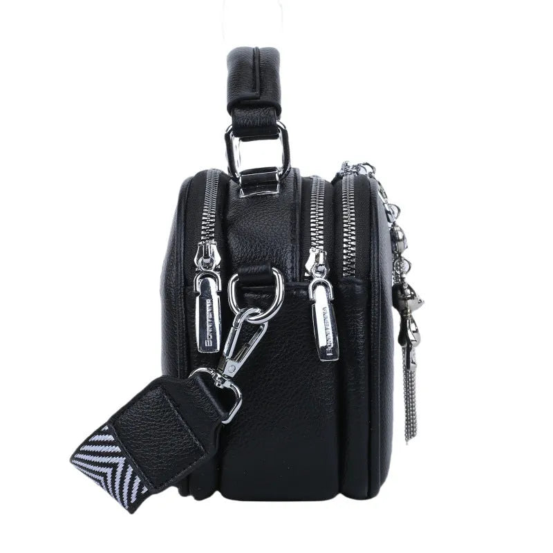 Women's small oval crossbody bag in PU with stitching detail and double straps, shown in multiple colours.