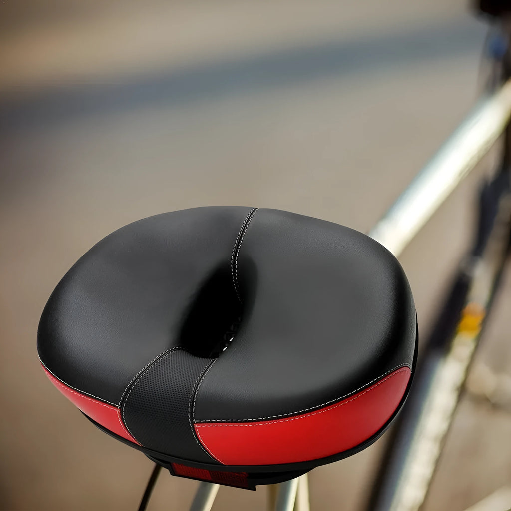 Large thickened bicycle saddle in red, grey, or light brown with reflective stickers.