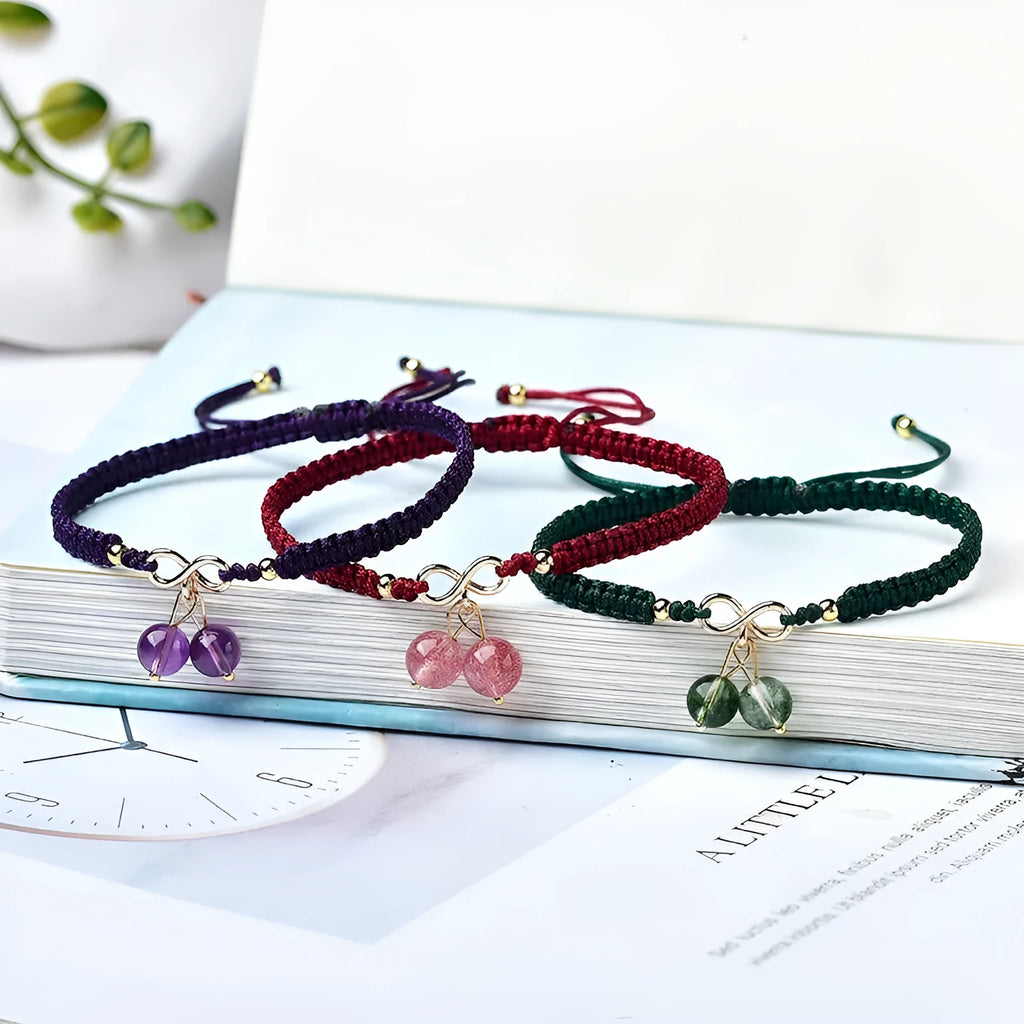 Women's natural strawberry quartz bracelet with fruit-shaped pendant and adjustable cord closure