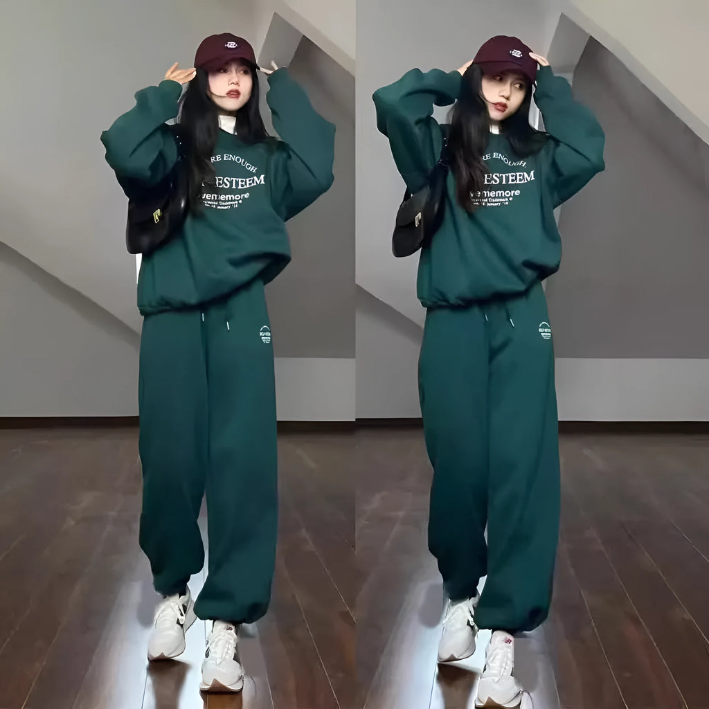 Women's cotton green American-style long-sleeved casual sportswear suit with trousers on a model