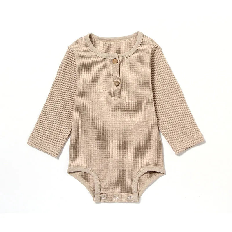 Waffle cotton baby romper with long sleeves in beige colour with cotton rope ties
