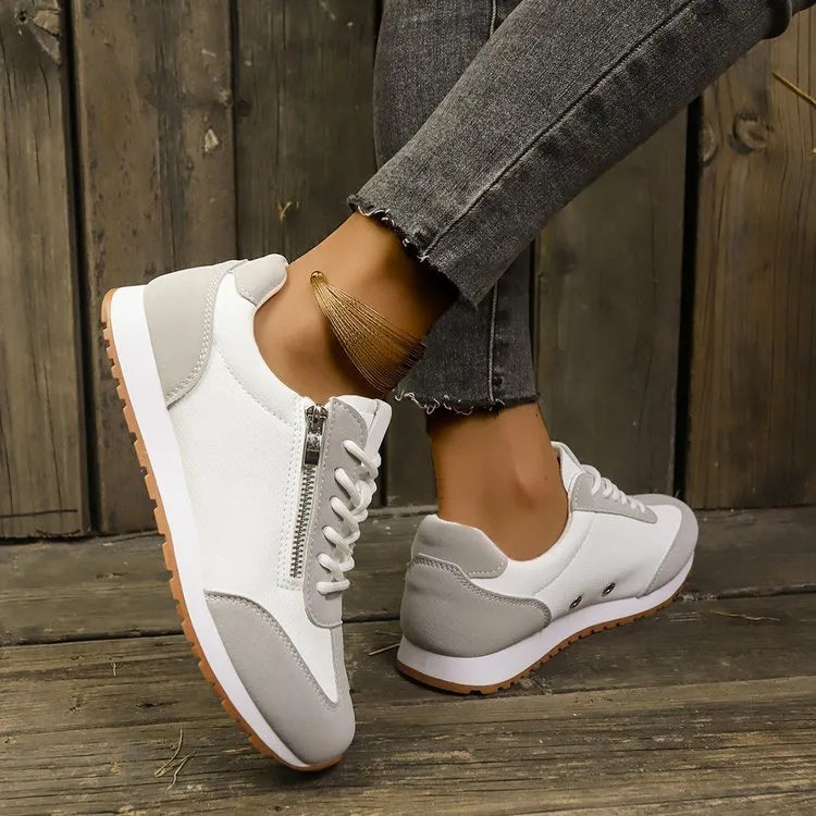 Women's flat-heeled casual shoe in artificial PU, shown in grey, white, and champagne colour options.