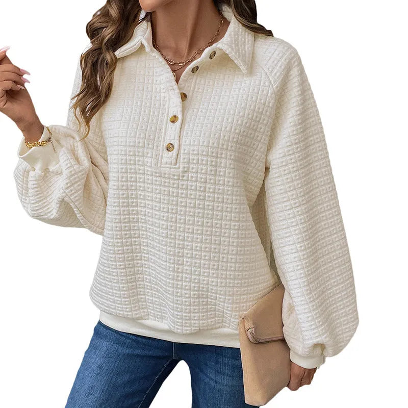 Beige women's textured knit sweater with a polo collar and long sleeves.
