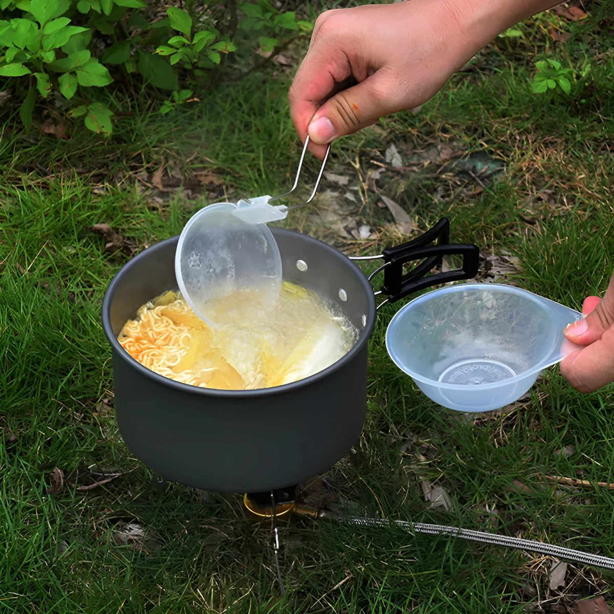 Folding camping pot set for 2-3 people in aluminium alloy, shown as a portable mini cookware kit in green, black, or orange.