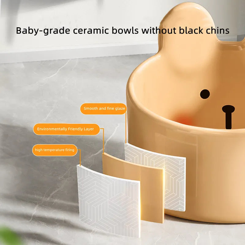 White and yellow ceramic pet feeding bowls with animal patterns in large and small sizes