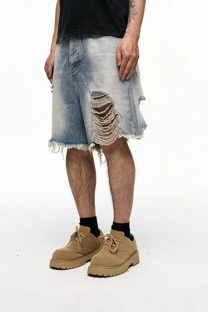 Light blue men's baggy retro denim shorts on a mid waist, showing wide leg and fifth pants length