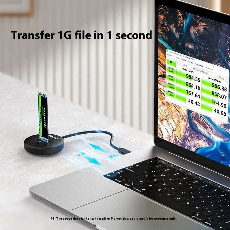 Black external NVME to USB-C SSD enclosure with 10Gbps speed on a desk.