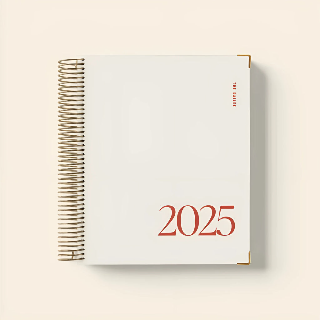 Cherry red daily schedule coil notebook with spiral binding open to show planning pages
