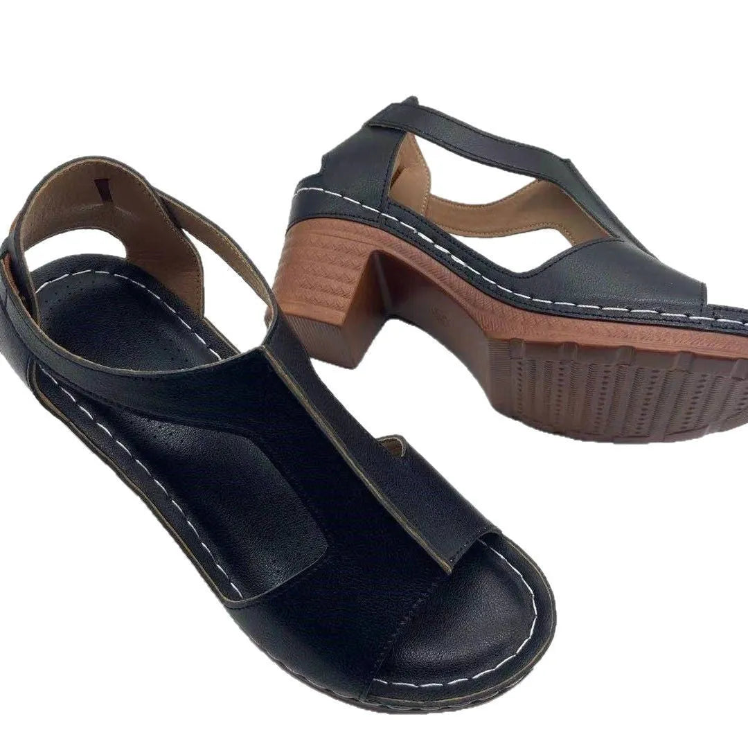 Women's beige peep toe wedge sandals with ankle buckle, shown on a foot.