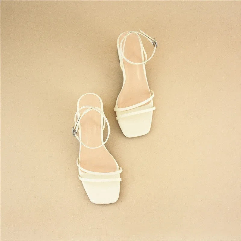 Beige women's sandals with a stiletto chunky heel, square toe, and an ankle buckle strap.