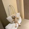 Cotton and linen woven dumpling-shaped shoulder bag with double straps in khaki colour.