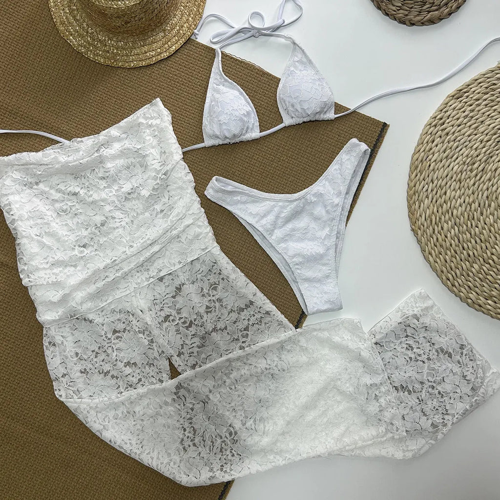 Solid white three-piece women's swimsuit set with nylon and spandex fabric